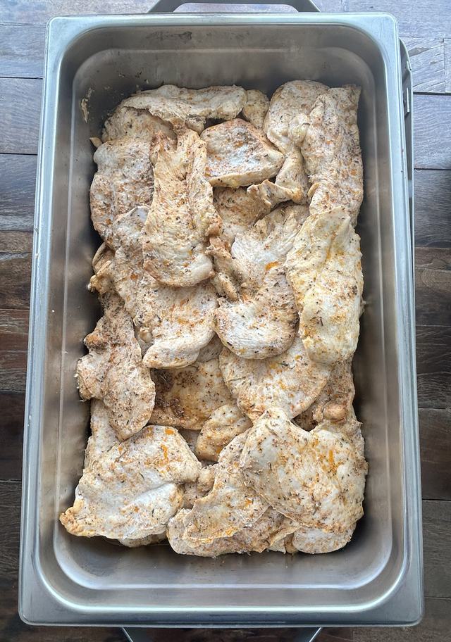 A pan of herb seasoned roasted chicken breasts